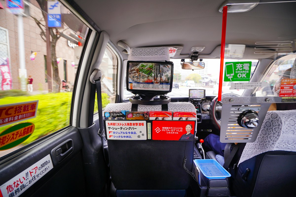 In-taxi headrest advertising display screen