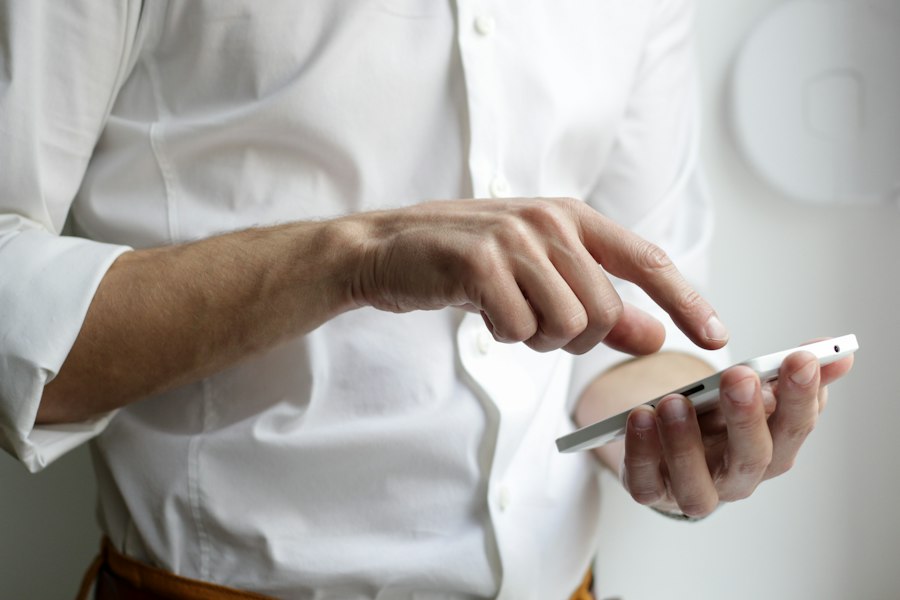 Person holding a smartphone running a mobile app